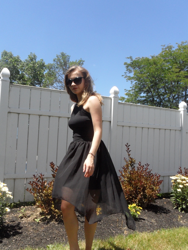 fashionable black skirt and sunglasses
