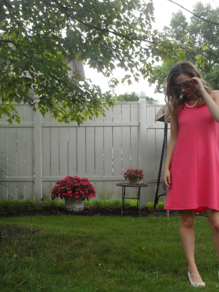 fashion blogger wearing pink dress