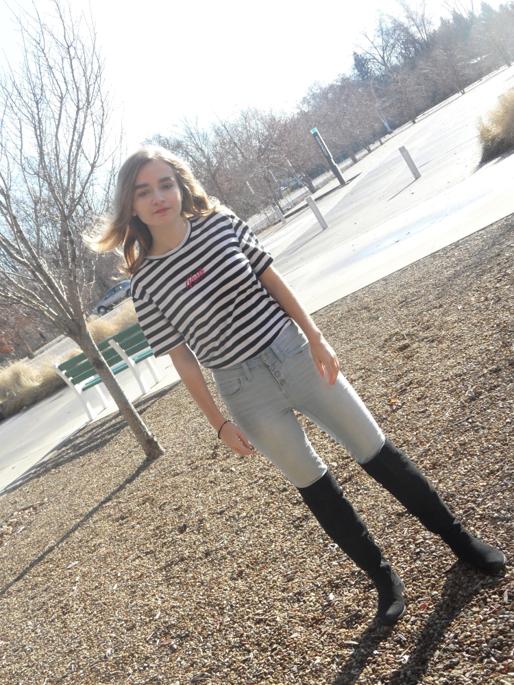 fashion blogger wears striped shirt and boots