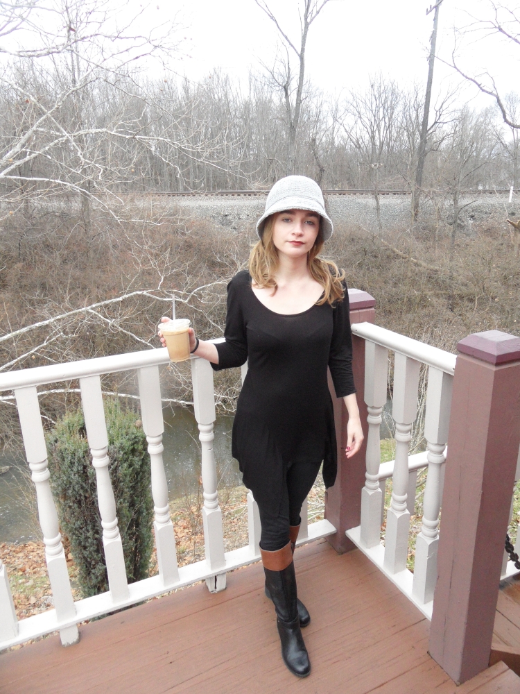 fashion blogger wears hat and dress